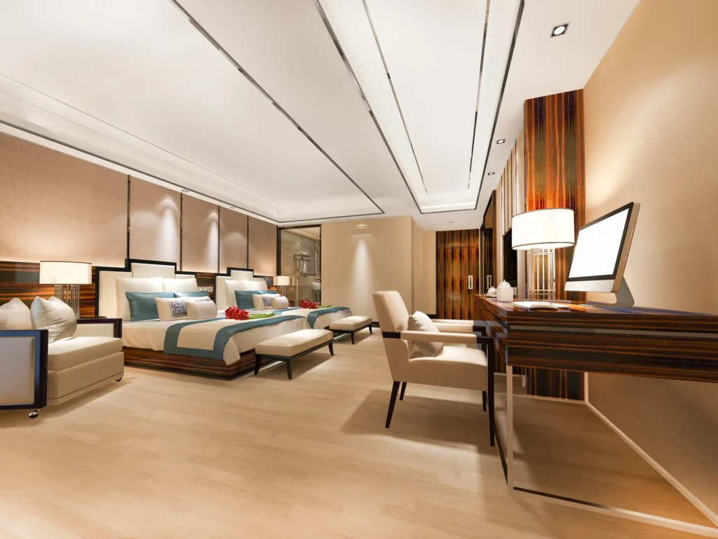 Fotografía de una habitación lujosa de dos camas que es uno de los tipos de habitaciones de un hotel